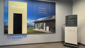 the-tesla-powerwall-and-solar-sign-at-the-entrance-of-the-tesla